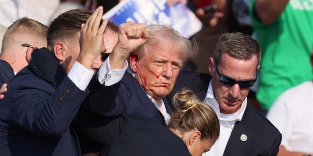 Trump'ın mitinginde silahlı saldırı: Kulağından yaralandı